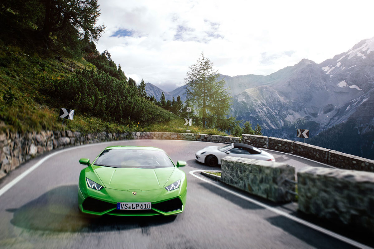 Lamborghini and Porsche 911 at turn 26 on the Stelvio Pass